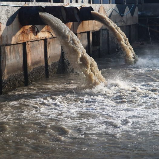 Industrial and factory waste water discharge pipe into the canal and sea, dirty water pollution